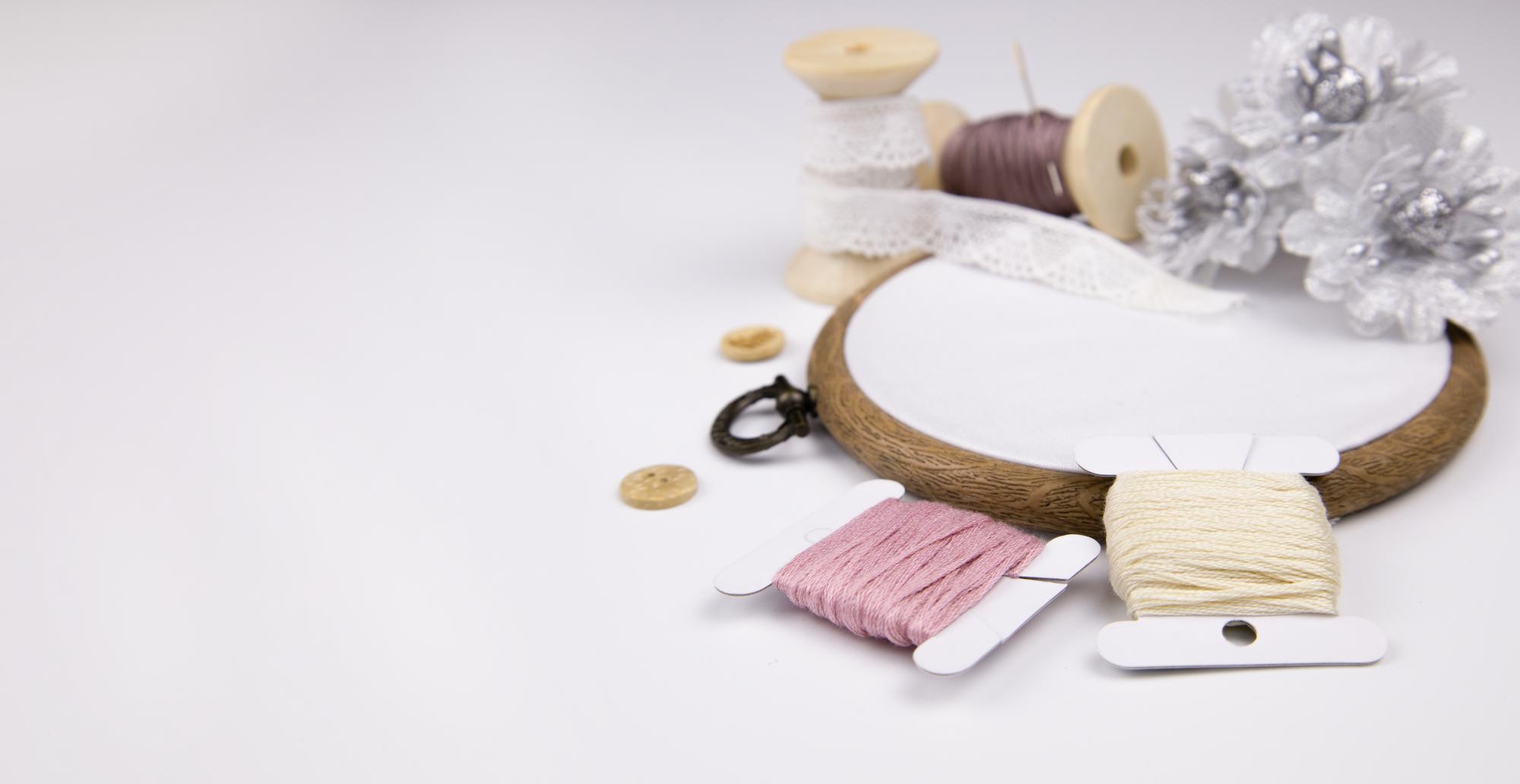atelier workspace with threads and samples on table